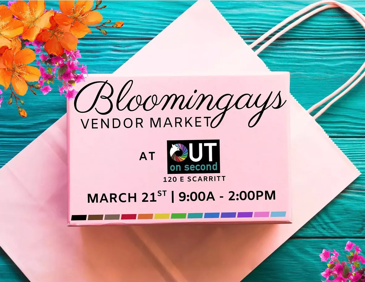 A bright, spring-themed flyer for the Bloomingays Vendor Market. The design features vibrant pink and orange flowers surrounding a light pink shopping bag with a small pink box on top. The text on the box states the event is held at OUT on Second located at 120 E. Scarritt, on March 21st from 9:00 AM to 2:00 PM.
